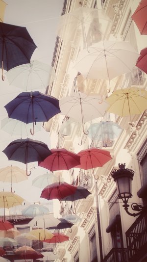 Floating-Colorful-Umbrellas-In-City-iphone-6-wallpaper-ilikewallpaper_com.jpg