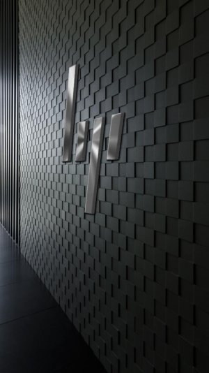 HP new metal logo on fancy wall.jpg